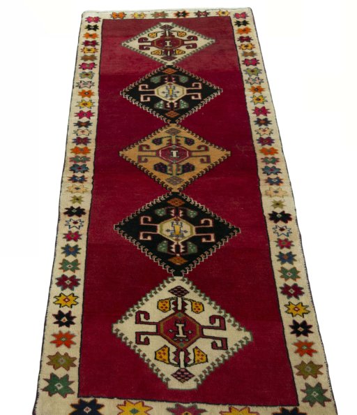 Surface texture of 2000s Persian Gabbeh rug with natural Wool and intricate pattern