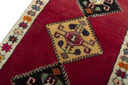 Backside of handmade 2000s Persian Gabbeh rug showing knot structure and weave density