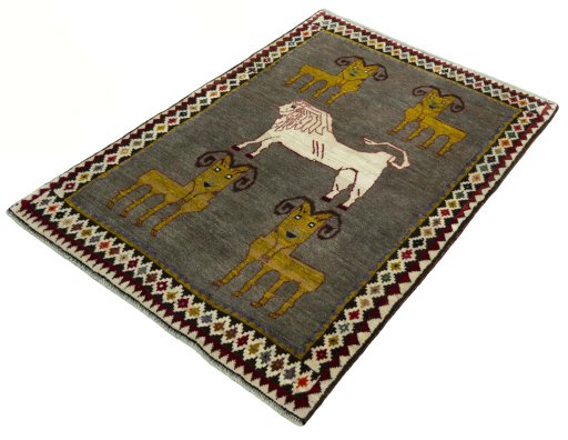 Corner detail of 2000s Persian Gabbeh rug showing border pattern and Wool pile