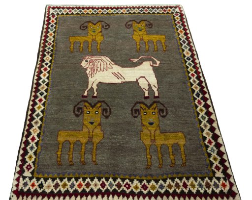 Surface texture of 2000s Persian Gabbeh rug with natural Wool and intricate pattern