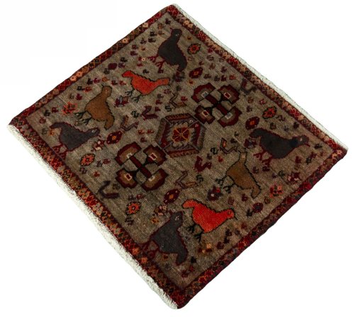 Corner detail of 2000s Persian Gabbeh rug showing border pattern and Wool pile