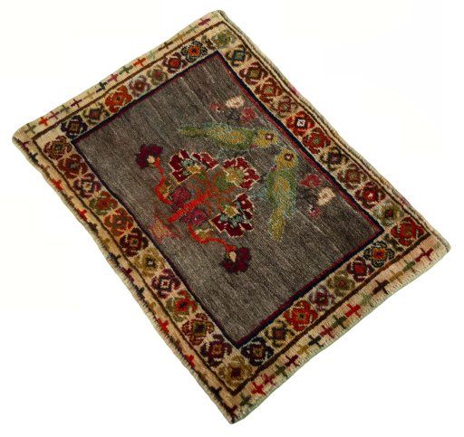 Corner detail of 2000s Persian Gabbeh rug showing border pattern and Wool pile