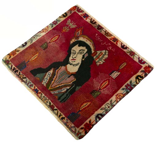 Corner detail of 2000s Persian Gabbeh rug showing border pattern and Wool pile