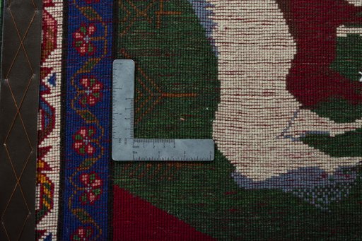 Backside of handmade 2000s Persian Gabbeh rug showing knot structure and weave density