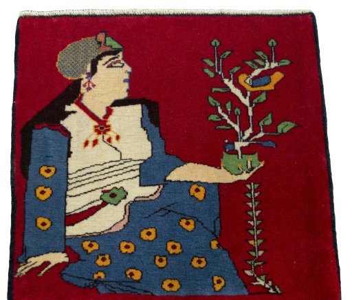 Surface texture of 2000s Persian Gabbeh rug with natural Wool and intricate pattern