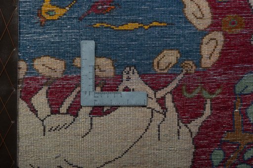 Backside of handmade 2000s Persian Gabbeh rug showing knot structure and weave density