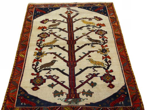 Surface texture of 2000s Persian Gabbeh rug with natural Wool and intricate pattern