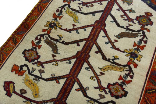 Backside of handmade 2000s Persian Gabbeh rug showing knot structure and weave density