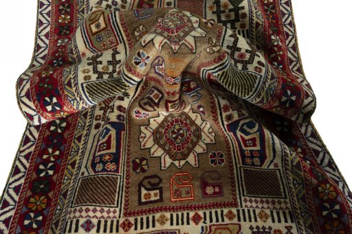 Corner detail of 2000s Persian Gabbeh rug showing border pattern and Wool pile