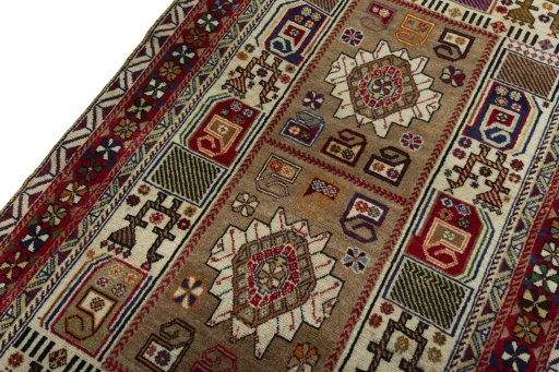 Backside of handmade 2000s Persian Gabbeh rug showing knot structure and weave density