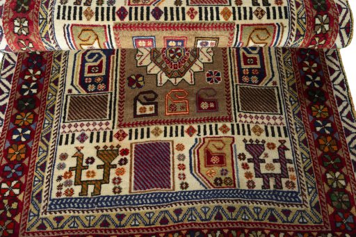 Full view of 2000s Persian Gabbeh rug from Iran / Persia, 185 × 106 cm in Beige tones