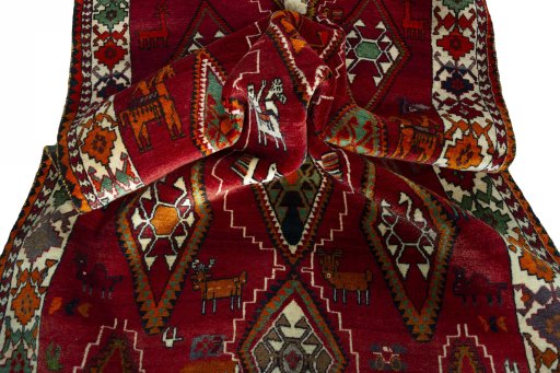 Corner detail of 2000s Persian Gabbeh rug showing border pattern and Wool pile