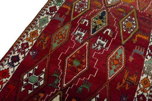Backside of handmade 2000s Persian Gabbeh rug showing knot structure and weave density