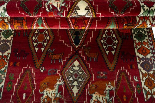 Full view of 2000s Persian Gabbeh rug from Iran / Persia, 249 × 145 cm in Red tones