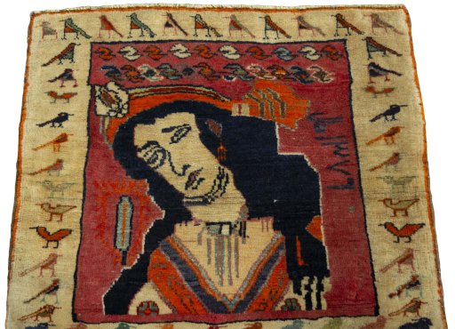 Surface texture of 2000s Persian Gabbeh rug with natural Wool and intricate pattern