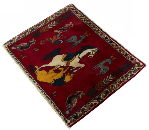 Corner detail of 2000s Persian Gabbeh rug showing border pattern and Wool pile