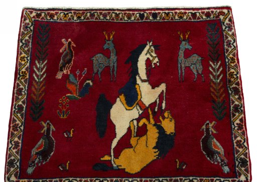 Surface texture of 2000s Persian Gabbeh rug with natural Wool and intricate pattern