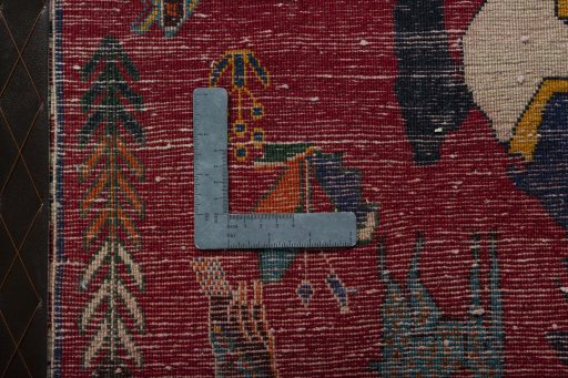 Backside of handmade 2000s Persian Gabbeh rug showing knot structure and weave density