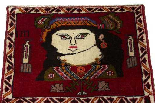 Surface texture of 2000s Persian Gabbeh rug with natural Wool and intricate pattern