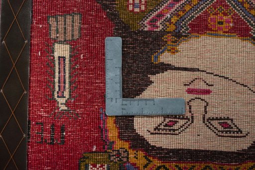Backside of handmade 2000s Persian Gabbeh rug showing knot structure and weave density