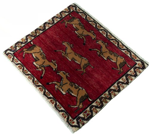 Corner detail of 2000s Persian Gabbeh rug showing border pattern and Wool pile