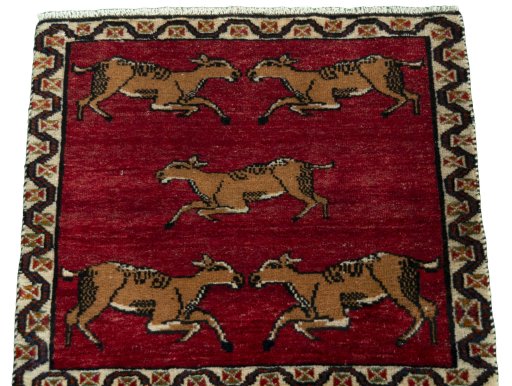 Surface texture of 2000s Persian Gabbeh rug with natural Wool and intricate pattern