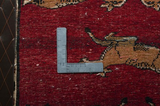 Backside of handmade 2000s Persian Gabbeh rug showing knot structure and weave density