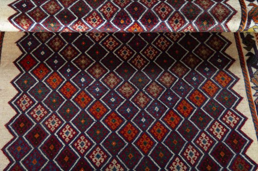Full view of 2000s Persian Gabbeh rug from Iran / Persia, 197 × 113 cm in Multi Color tones