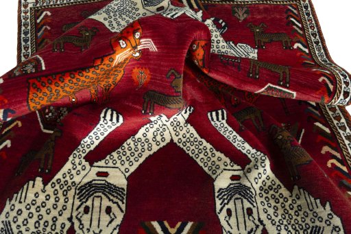 Corner detail of 1970s Persian Gabbeh rug showing border pattern and Wool pile