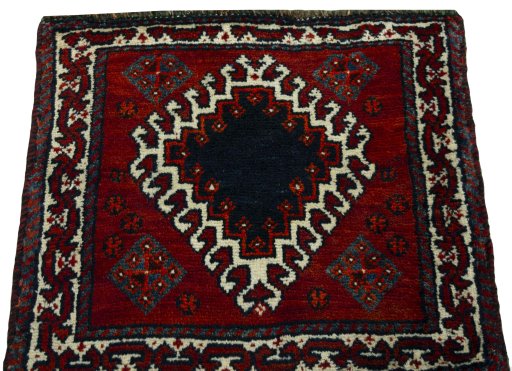 Surface texture of 2000s Persian Gabbeh rug with natural Wool and intricate pattern