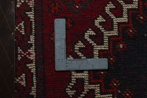 Backside of handmade 2000s Persian Gabbeh rug showing knot structure and weave density
