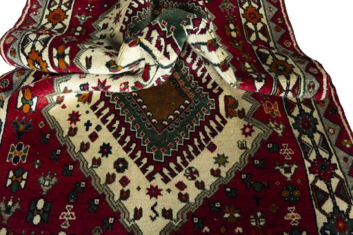 Corner detail of 2000s Persian Gabbeh rug showing border pattern and Wool pile