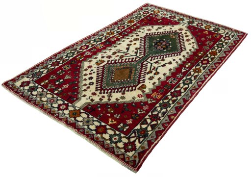 Corner detail of 2000s Persian Gabbeh rug showing border pattern and Wool pile