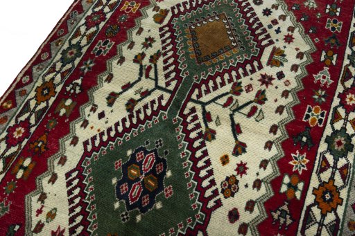 Backside of handmade 2000s Persian Gabbeh rug showing knot structure and weave density