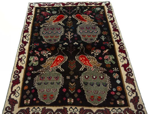 Surface texture of 2000s Persian Gabbeh rug with natural Wool and intricate pattern