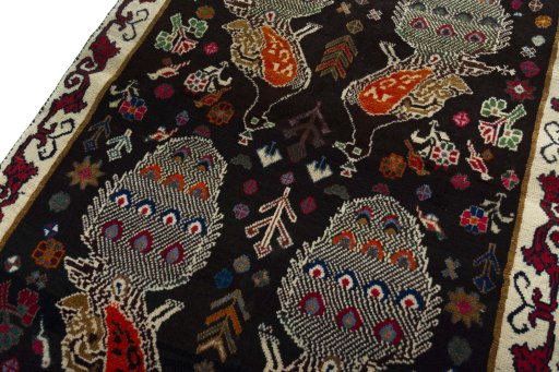 Backside of handmade 2000s Persian Gabbeh rug showing knot structure and weave density