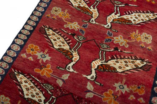 Backside of handmade 2000s Persian Gabbeh rug showing knot structure and weave density