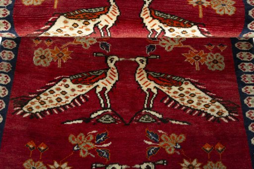 Full view of 2000s Persian Gabbeh rug from Iran / Persia, 186 × 100 cm in Red tones
