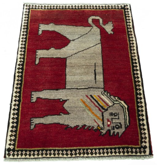 Surface texture of 2000s Persian Gabbeh rug with natural Wool and intricate pattern