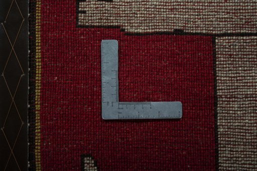 Full view of 2000s Persian Gabbeh rug from Iran / Persia, 95 × 69 cm in Red tones