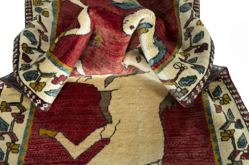 Corner detail of 2000s Persian Gabbeh rug showing border pattern and Wool pile
