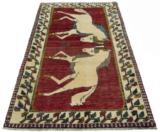 Surface texture of 2000s Persian Gabbeh rug with natural Wool and intricate pattern