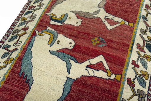 Backside of handmade 2000s Persian Gabbeh rug showing knot structure and weave density