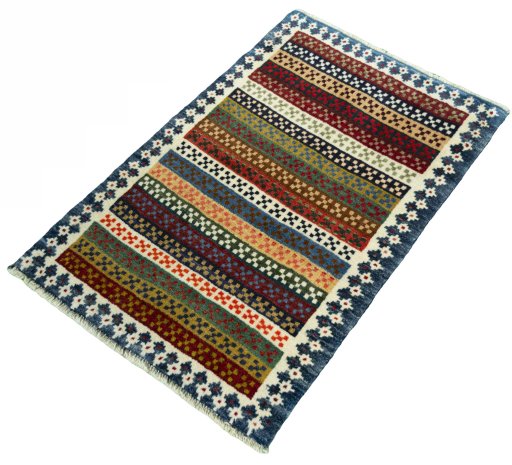 Corner detail of 2000s Persian Gabbeh rug showing border pattern and Wool pile