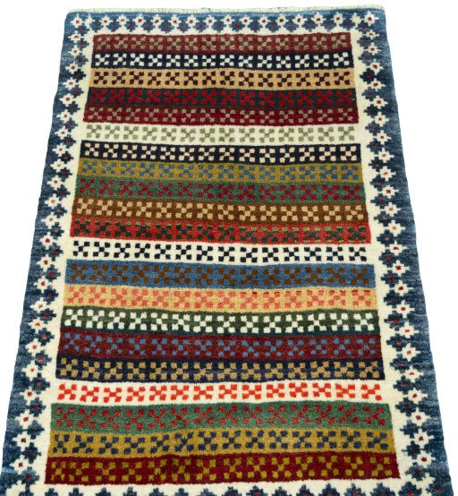 Surface texture of 2000s Persian Gabbeh rug with natural Wool and intricate pattern