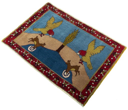 Corner detail of 2000s Persian Gabbeh rug showing border pattern and Wool pile