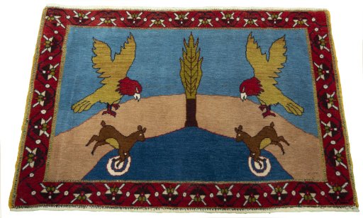 Surface texture of 2000s Persian Gabbeh rug with natural Wool and intricate pattern