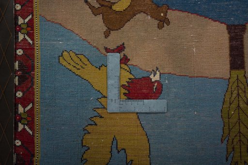 Backside of handmade 2000s Persian Gabbeh rug showing knot structure and weave density
