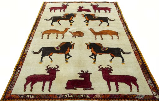 Surface texture of 2000s Persian Gabbeh rug with natural Wool and intricate pattern