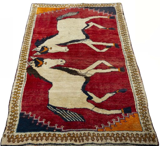 Surface texture of 2000s Persian Gabbeh rug with natural Wool and intricate pattern